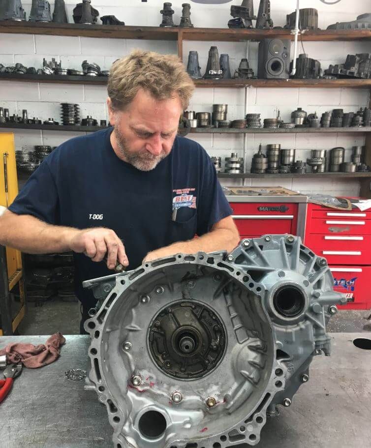 A professional working on a transmission