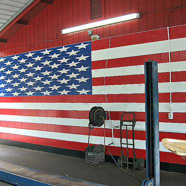 An American flag painted on a wall inside of transmission repair shop Best Transmission in Jacksonville, FL